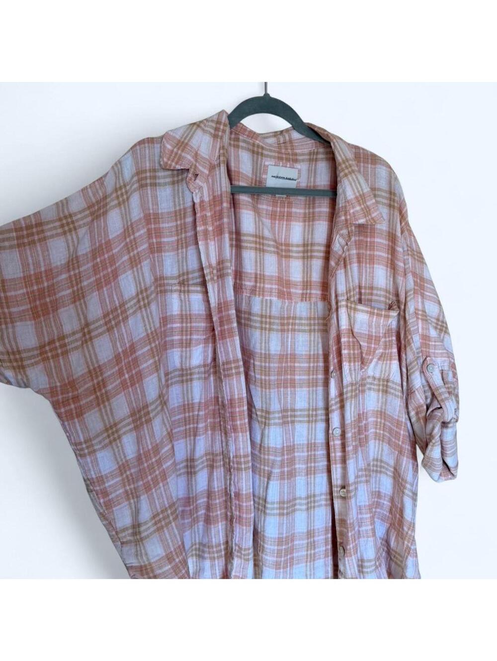 Soft pink and white plaid button-up flannel shirt